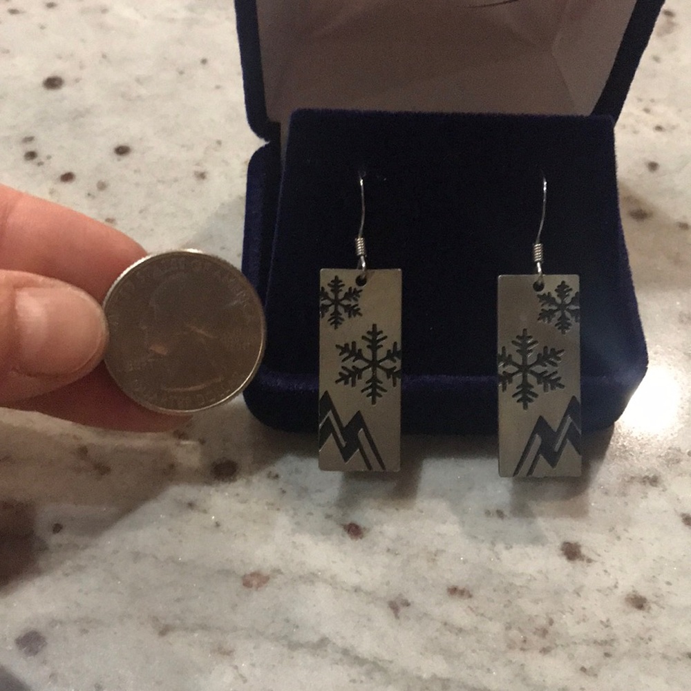 Graphic snowflake and mountain dangle